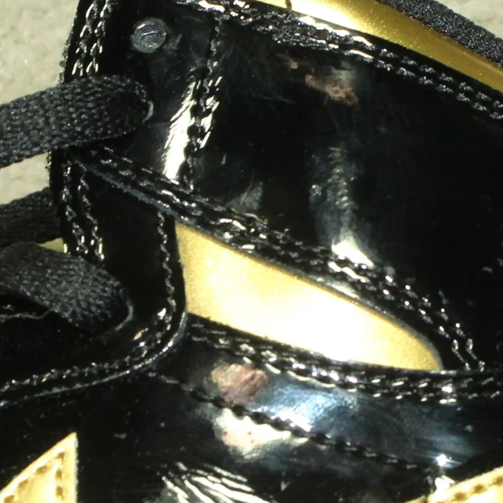 New IOB Jordan Boy's Size 6.5Y/ Women's 8 Black Patent Gold High Top Sneakers